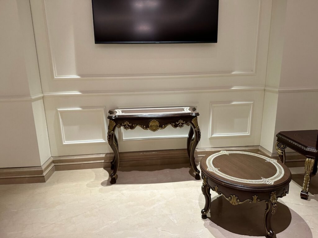 Console and round coffee table with white inlay borders and gilded carving by Morbagh Designs